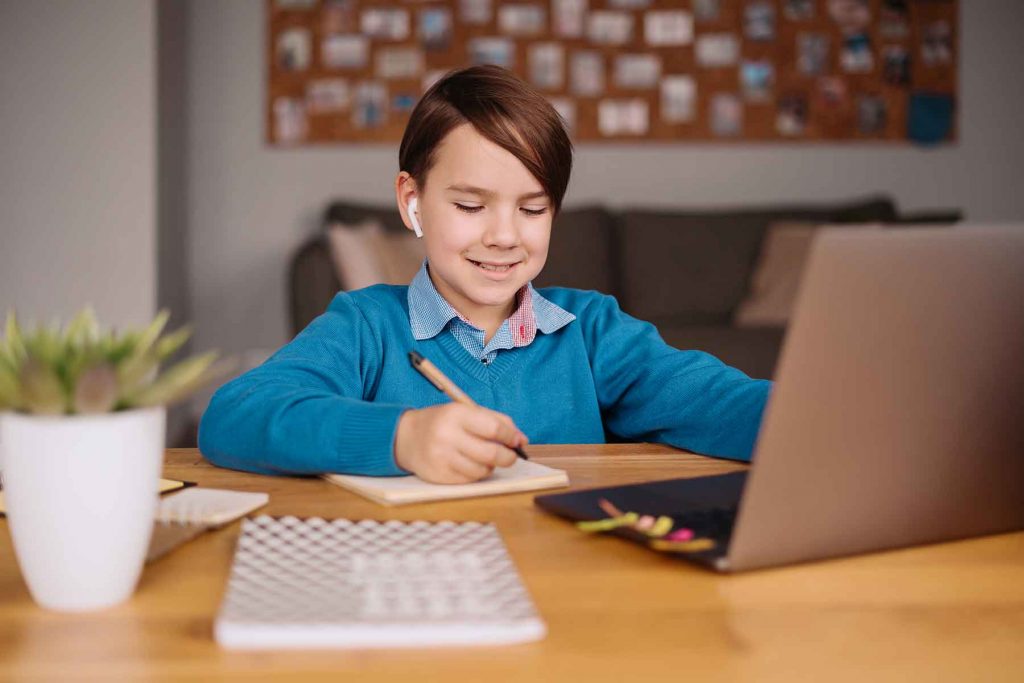 online learning boy using laptop Q98PZRX